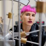 Interactive Learning - Student with Pink Hair inside a Science Laboratory