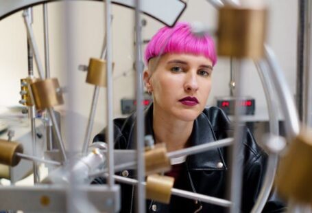 Interactive Learning - Student with Pink Hair inside a Science Laboratory