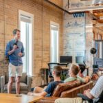 Corporate Learning - man standing in front of group of men