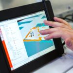 Virtual Reality Education - person holding black tablet computer