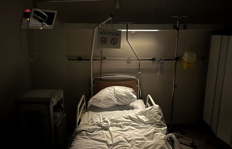 Mental Health Campus - a hospital room with a bed and a monitor