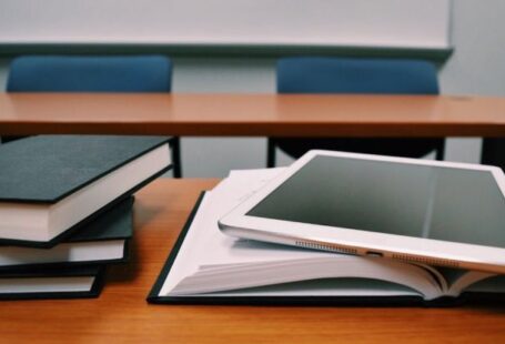 Virtual Classroom - Silver Ipad on White Book Page