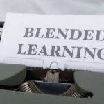 Flipped Classroom - A typewriter with a paper that says blended learning