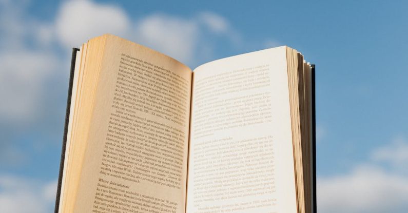 Cloud Education - Crop person with book in sunlight