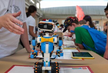 Education Robotics - A robot is on display at a table with people