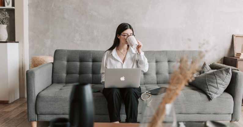 Coding Education - Woman Drinking Coffee While Working With Laptop