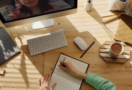 Tech School - Person Writing on Notebook