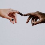 Global Peace - Hands of people reaching to each other