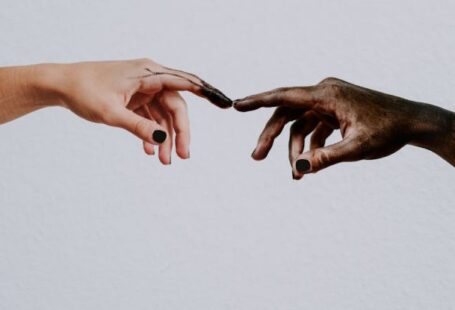 Global Peace - Hands of people reaching to each other