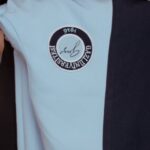 Education Trends - A woman in a black dress and blue jacket