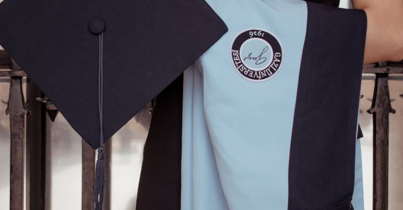 Refugee Education - A woman in a graduation gown holding a diploma