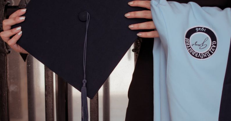 Transnational Education - A woman holding a graduation cap and gown