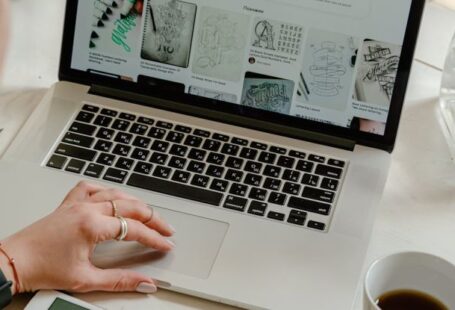 Creativity Technology - Person Using Macbook Pro on Table