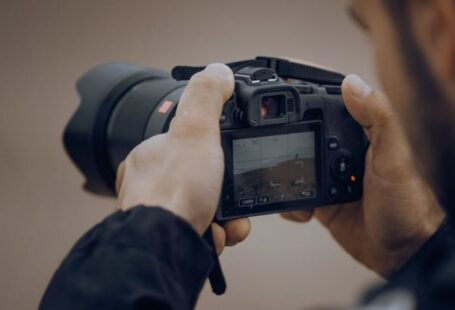 Digital Literacy - A man is taking a picture with his camera